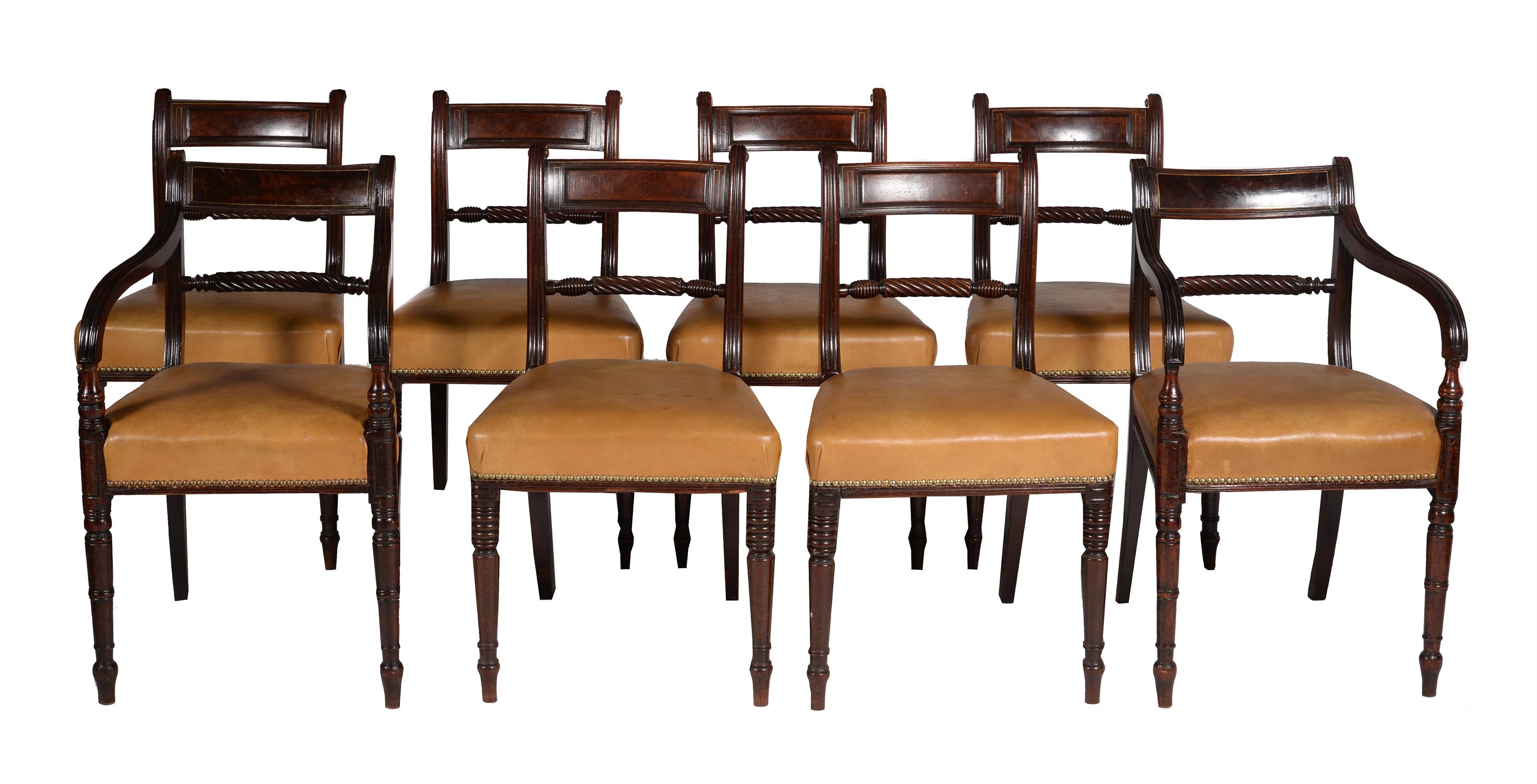 A set of six Regency mahogany and brass line inlaid dining chairs