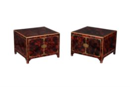 A pair of simulated tortoiseshell low cabinets