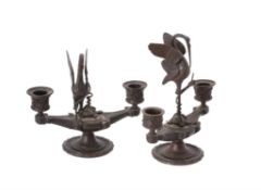 A pair of Italian bronze candle holders