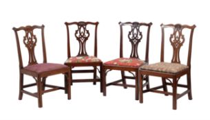 A set of four George III mahogany dining chairs