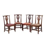 A set of four George III mahogany dining chairs