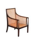 An Edwardian stained beech library armchair