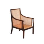 An Edwardian stained beech library armchair