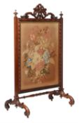 Y An early Victorian rosewood and needlework fire screen