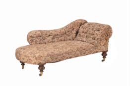 A Victorian carved walnut and upholstered chaise longue