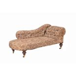 A Victorian carved walnut and upholstered chaise longue