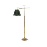 A brass adjustable standard lamp