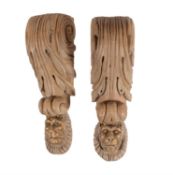 A pair of carved wood corbels