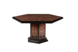 A black slate and variegated red marble inlaid centre table