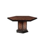 A black slate and variegated red marble inlaid centre table