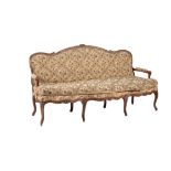 A Louis XV walnut and needlework upholstered sofa