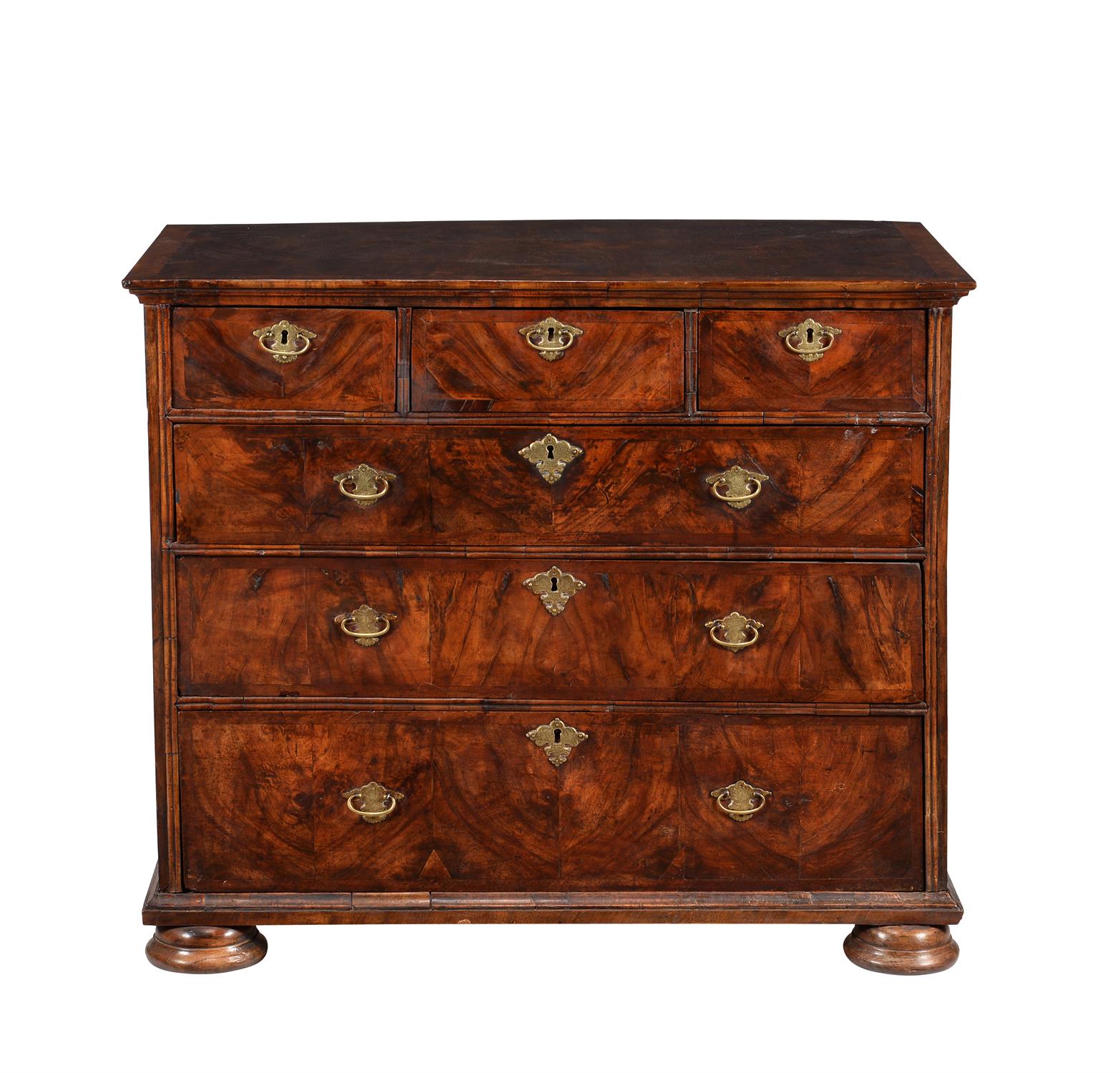 A walnut chest of drawers