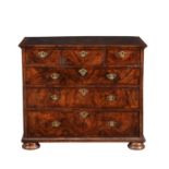 A walnut chest of drawers