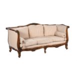 A French carved walnut and upholstered sofa or day bed