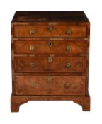 A walnut and feather banded chest of drawers