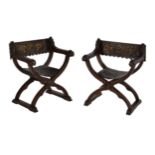 A pair of Italian carved walnut Savonarola armchairs