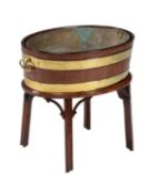 A George III mahogany and brass bound wine cooler