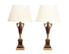 A pair of ormolu mounted polychrome painted toleware twin handled table lamps