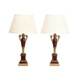 A pair of ormolu mounted polychrome painted toleware twin handled table lamps
