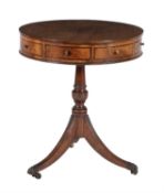 A mahogany drum table in George III style