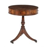 A mahogany drum table in George III style