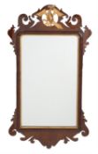 A walnut and parcel gilt fretwork wall mirror in George II style