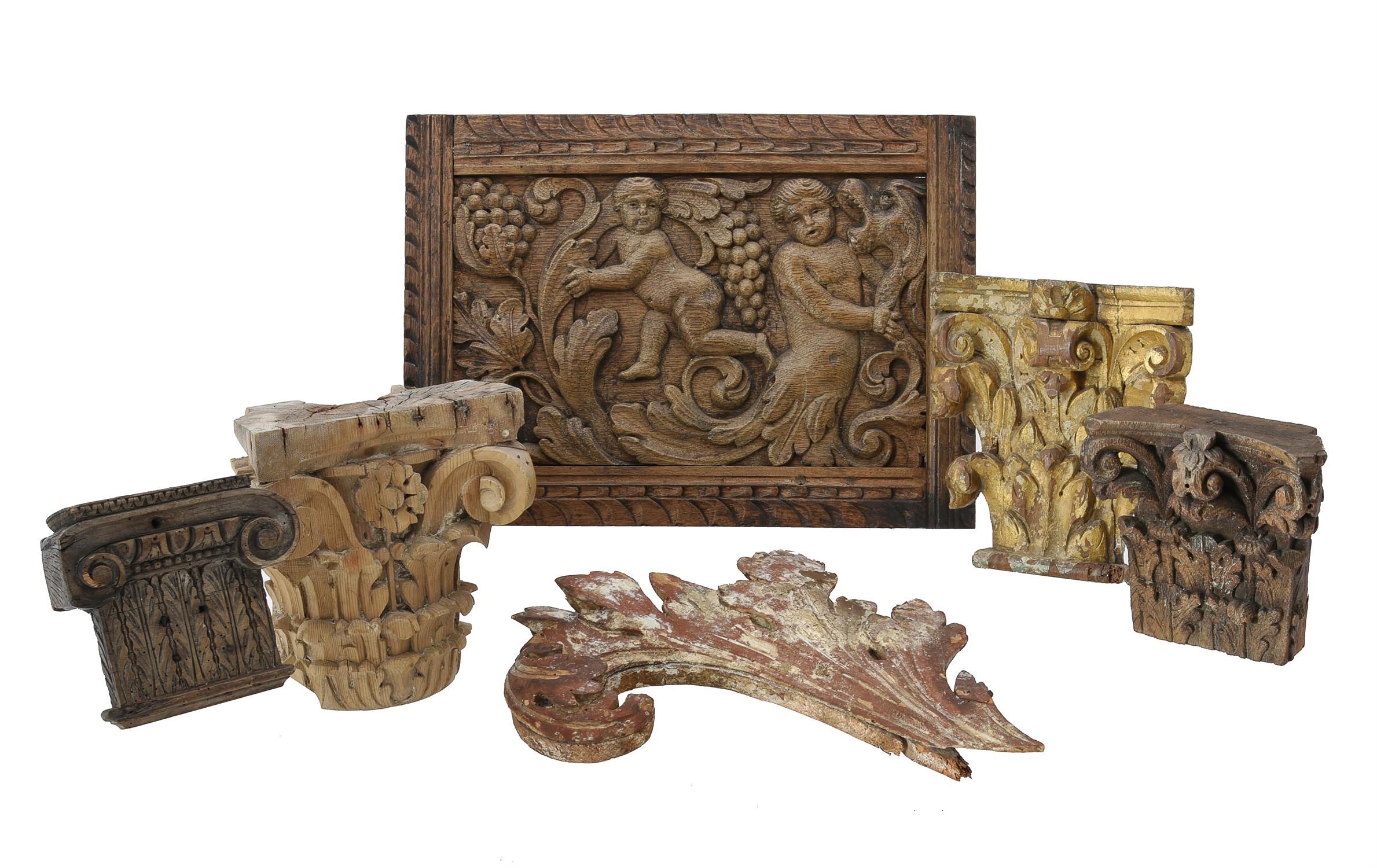 A group of five various carved wood fragments