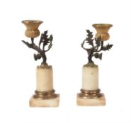 A pair of Regency gilt and patinated bronze and alabaster mounted candlesticks