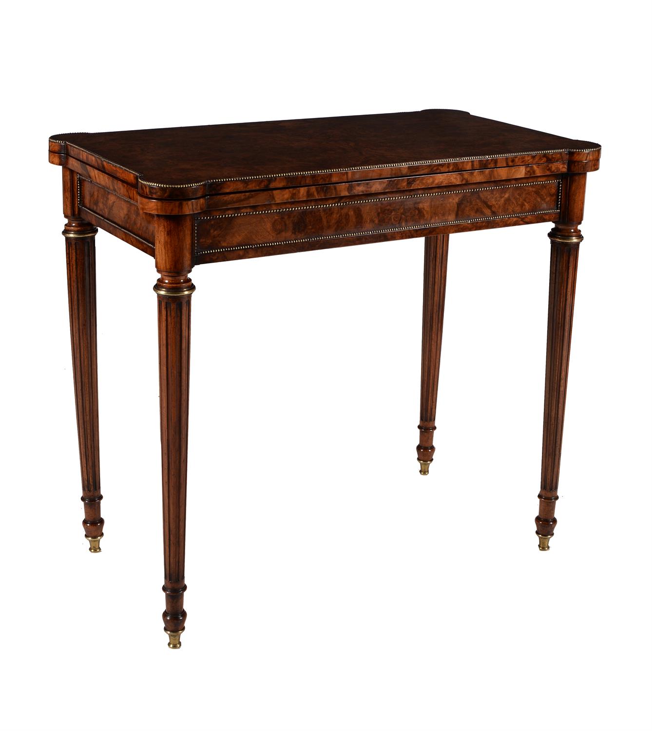 A Victorian burr walnut folding card table in French taste