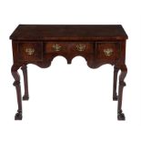 A red walnut side table in late 17th century style