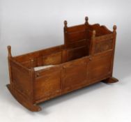 An Edwardian oak cot/cradle