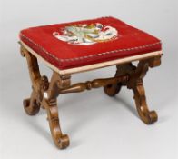 A Victorian walnut dressing stool