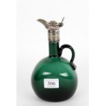 A green glass claret jug with plated mounts