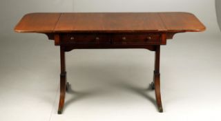 An early 19th century mahogany sofa table