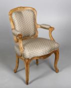 An oak and upholstered Fauteuil armchair