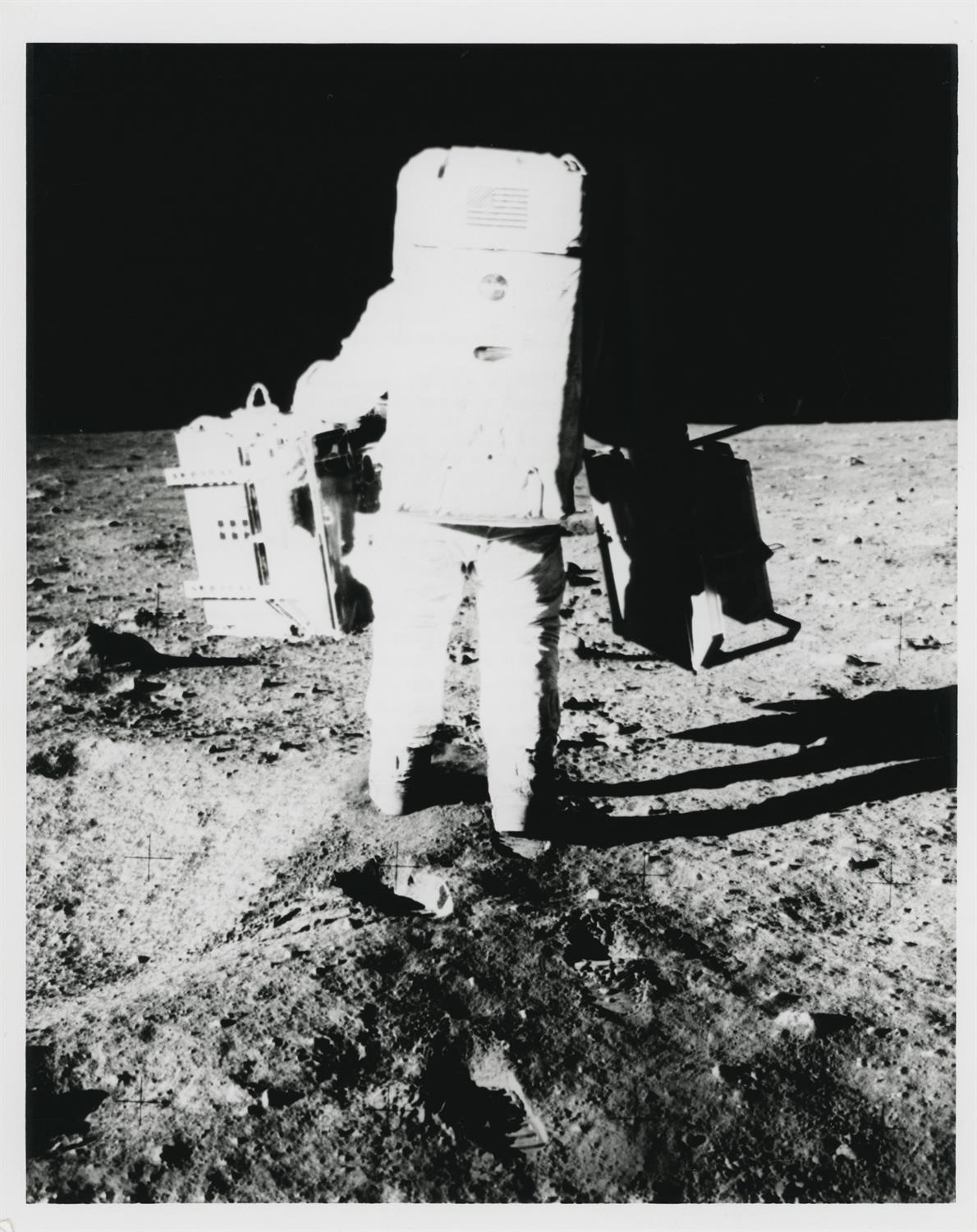 Photographic sequence: Buzz Aldrin carrying ALSEP to its deployment site, Apollo 11, July 1969 - Image 2 of 9