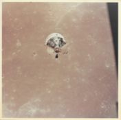 CM 'Columbia' over the lunar surface after separation from LM 'Eagle', Apollo 11, July 1969