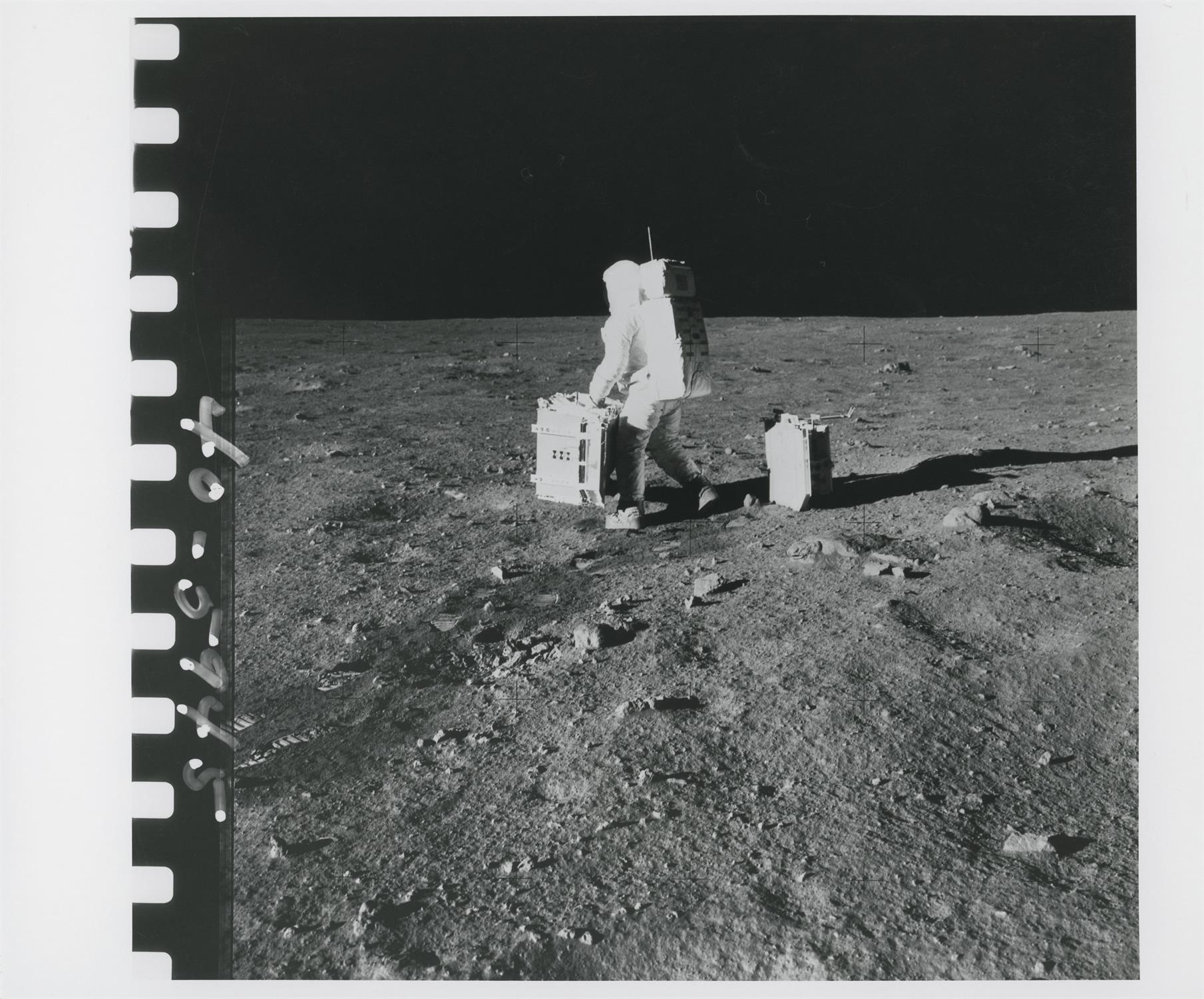 Photographic sequence: Buzz Aldrin carrying ALSEP to its deployment site, Apollo 11, July 1969 - Image 8 of 9