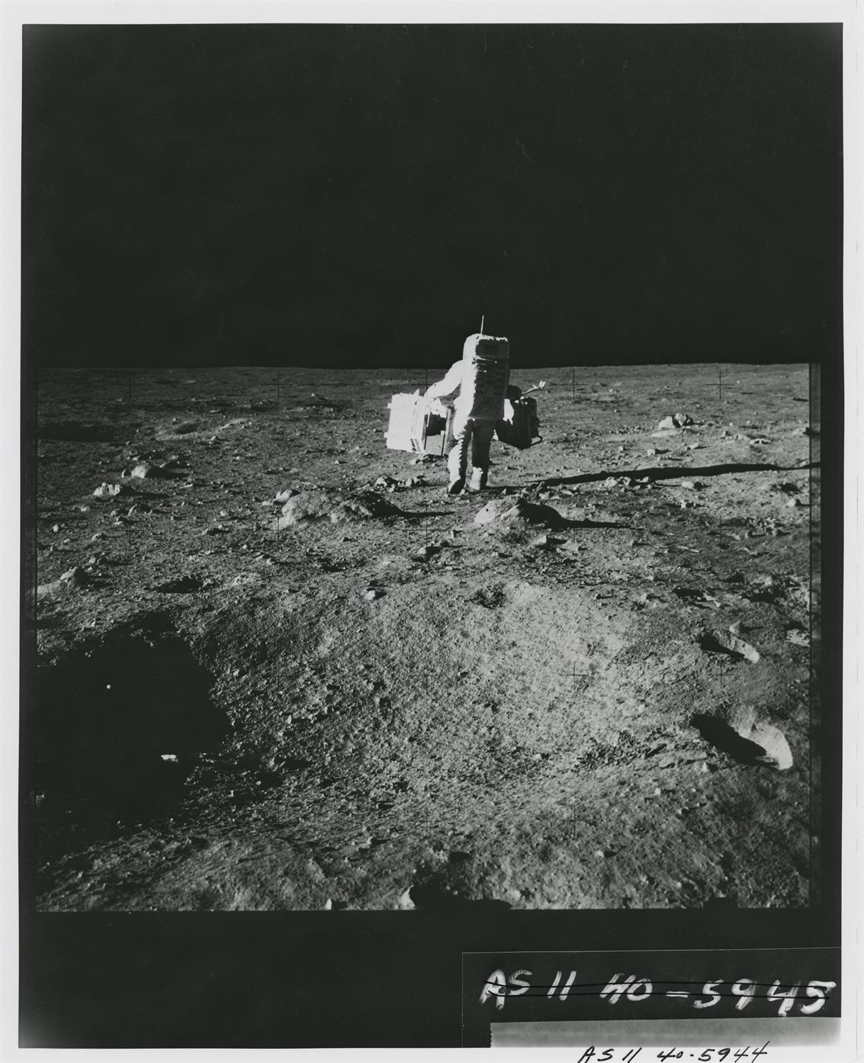 Photographic sequence: Buzz Aldrin carrying ALSEP to its deployment site, Apollo 11, July 1969 - Image 6 of 9