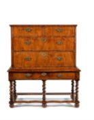 A walnut and line inlaid chest on stand, the chest circa 1700