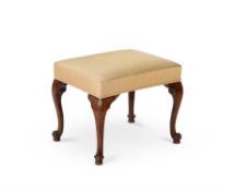 A George III mahogany and upholstered stool