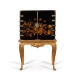 A black lacquer and gilt chinoiserie decorated cabinet