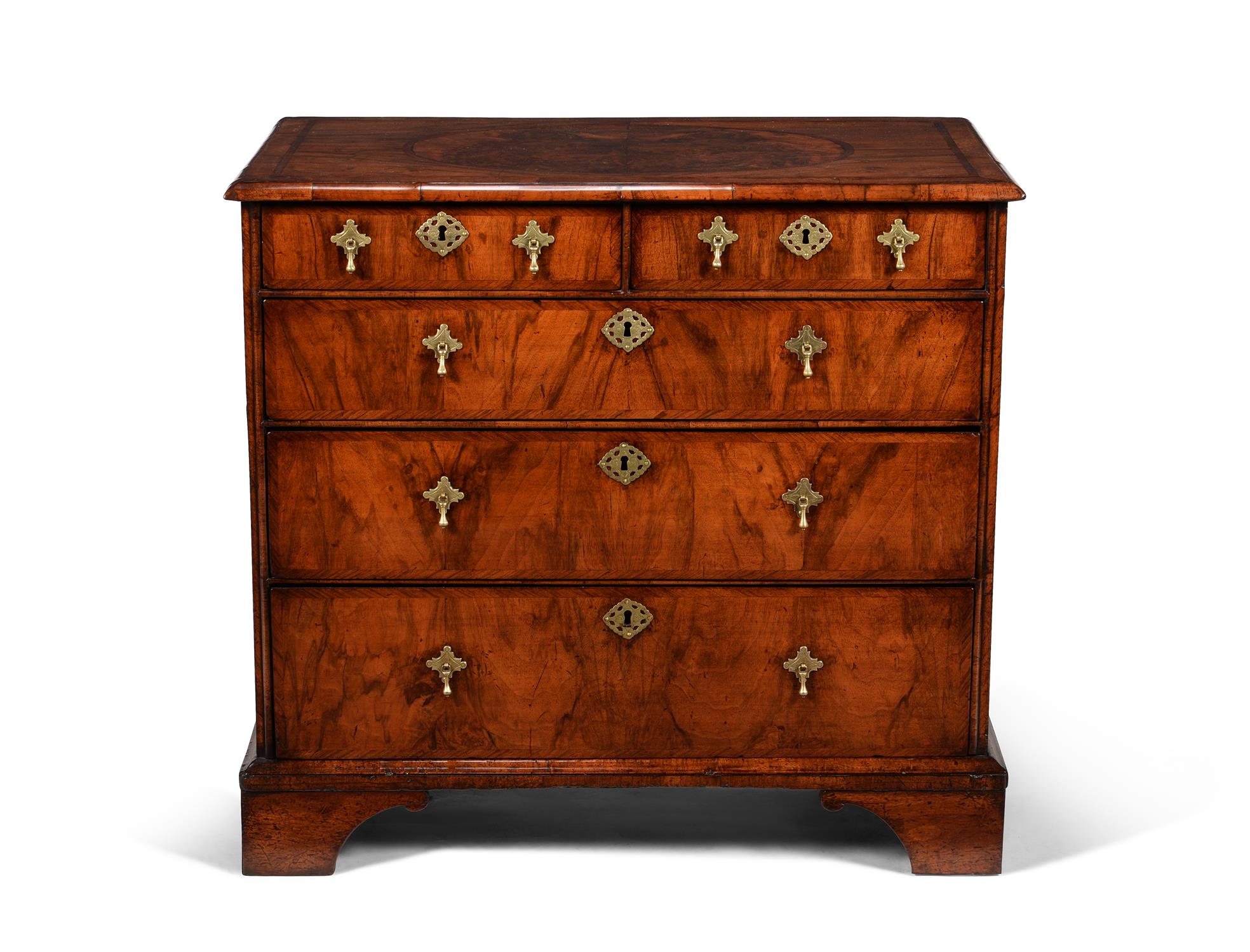 A George I walnut, burr walnut and feather banded chest of drawers
