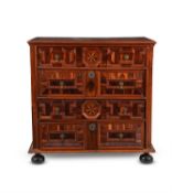 A William & Mary yew wood oyster veneered and inlaid chest of drawers