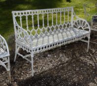 A Victorian white painted cast iron Gothic Revival garden bench