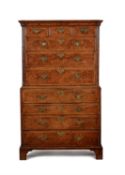 A George II burr walnut, walnut and feather banded secretaire chest on chest, circa 1740