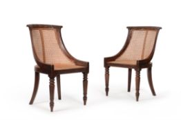 A pair of George IV simulated rosewood 'curricle' chairs