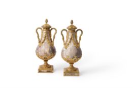 A pair of substantial French fleur de pecher marble and gilt bronze mounted urns and covers