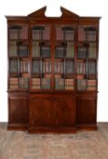 A George III mahogany breakfront secretaire library bookcase