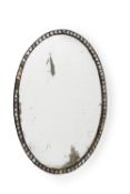 An Irish George III beaded glass oval wall mirror